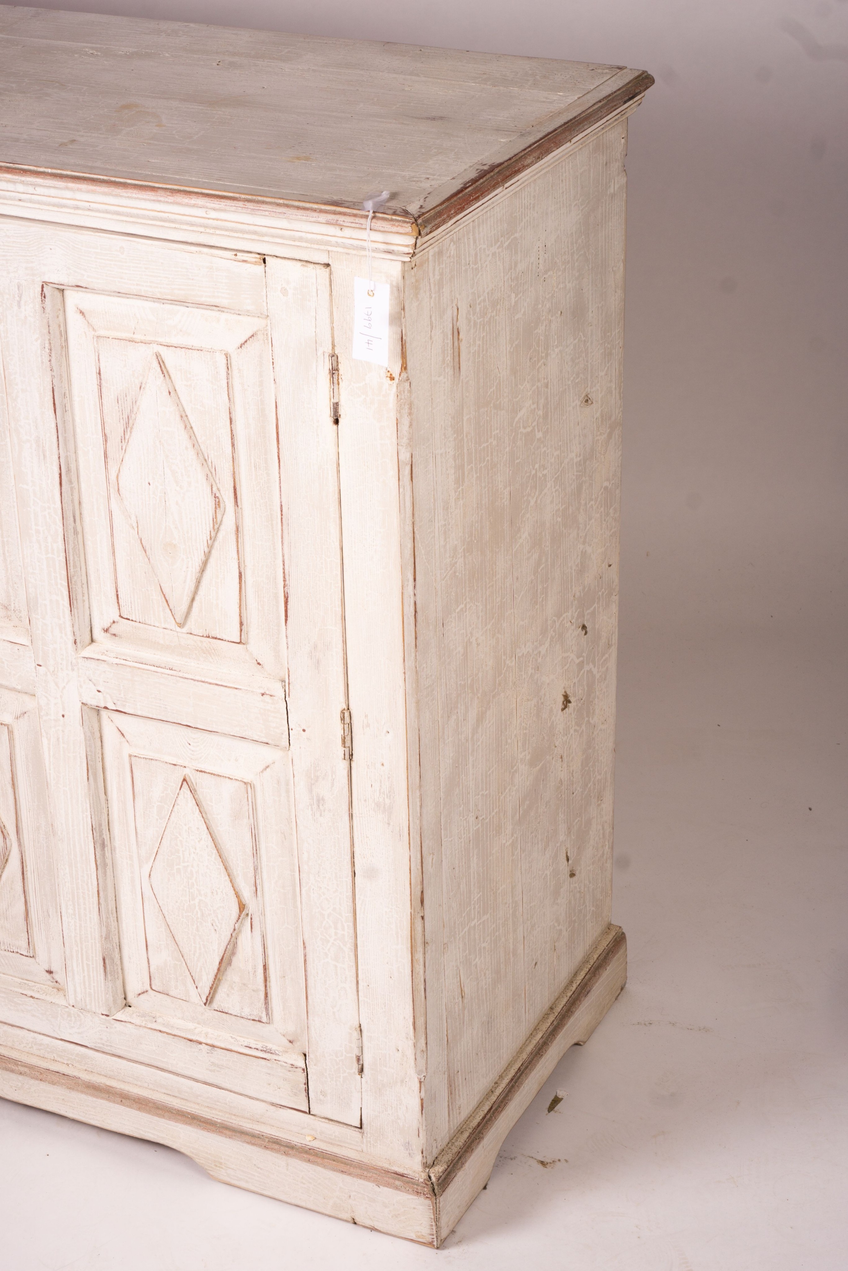 A 19th century Continental painted pine two door side cabinet, width 142cm, depth 50cm, height 106cm